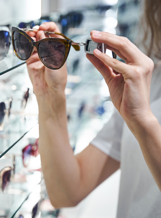 woman with sunglasses in her hands
